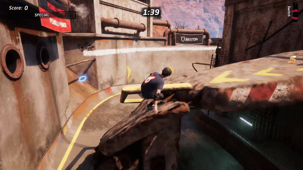 There's a skill point to the left on the turn before the downhill half pipe in Downhill Jam